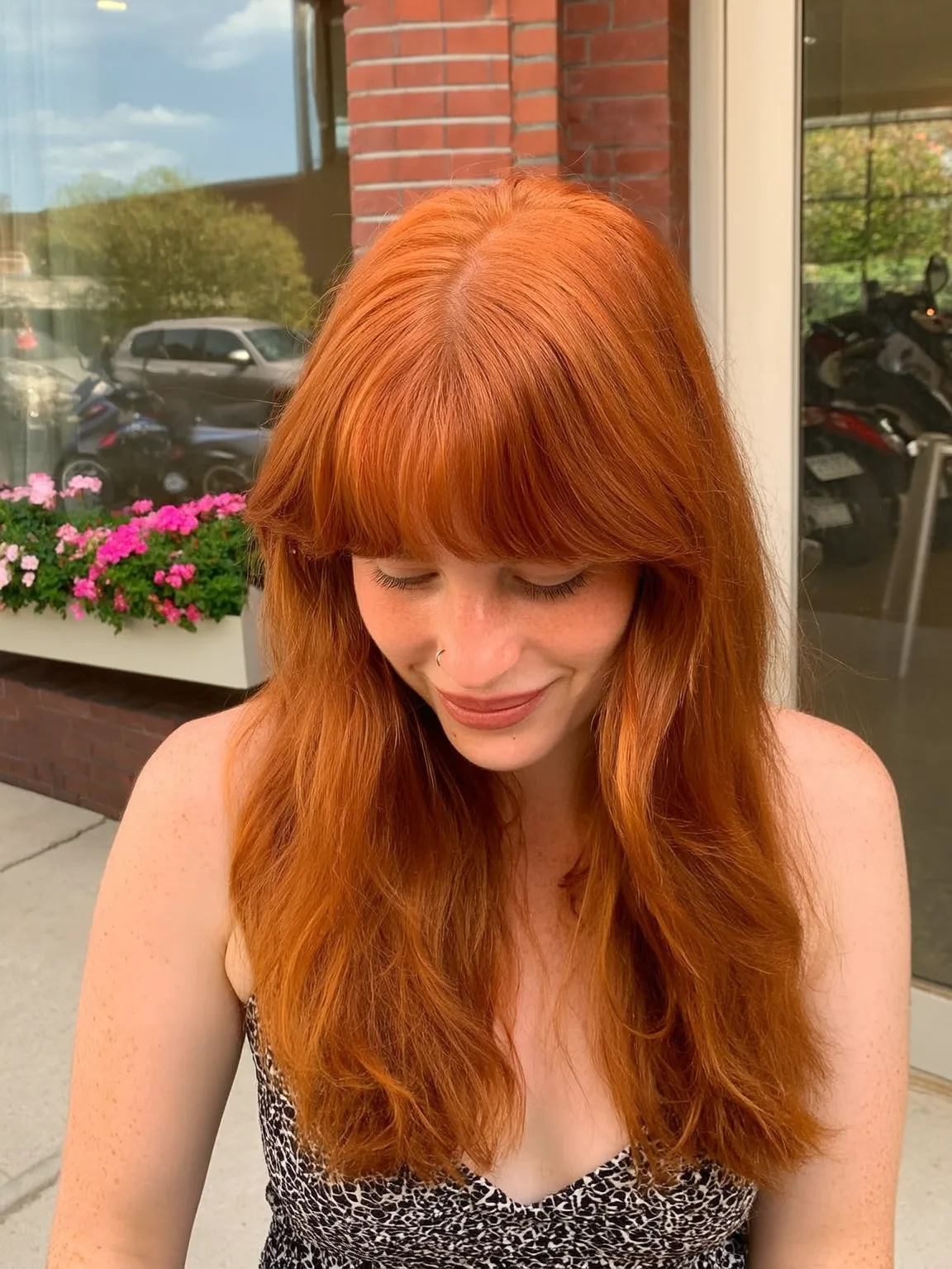 Vibrant Copper Red Long Layers with Blunt Bangs for Round Faces